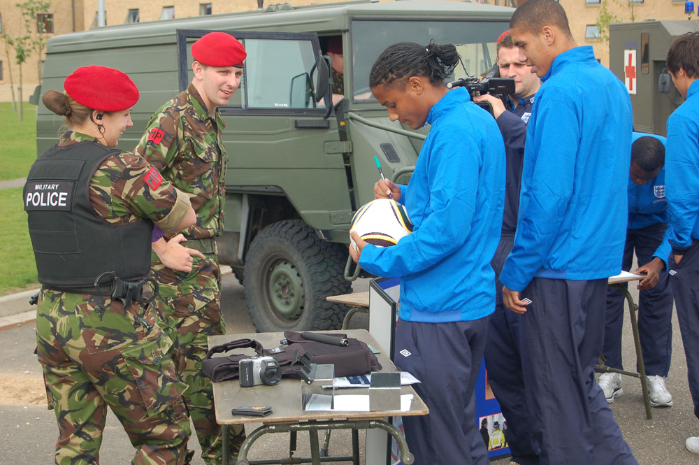 Michael Mancienne signs an autograph for the soldiers.
